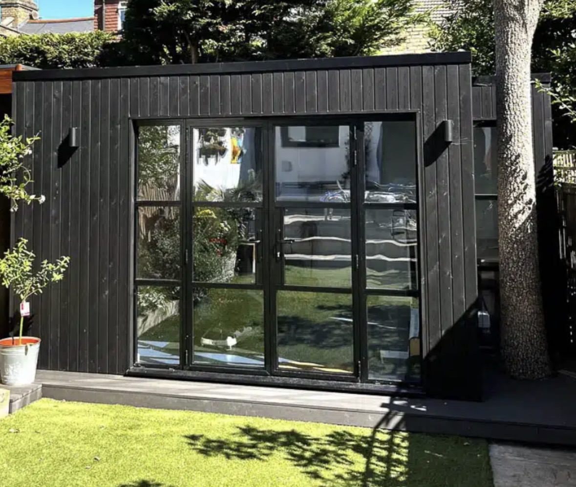 Black timber garden room designed and built by Greenview